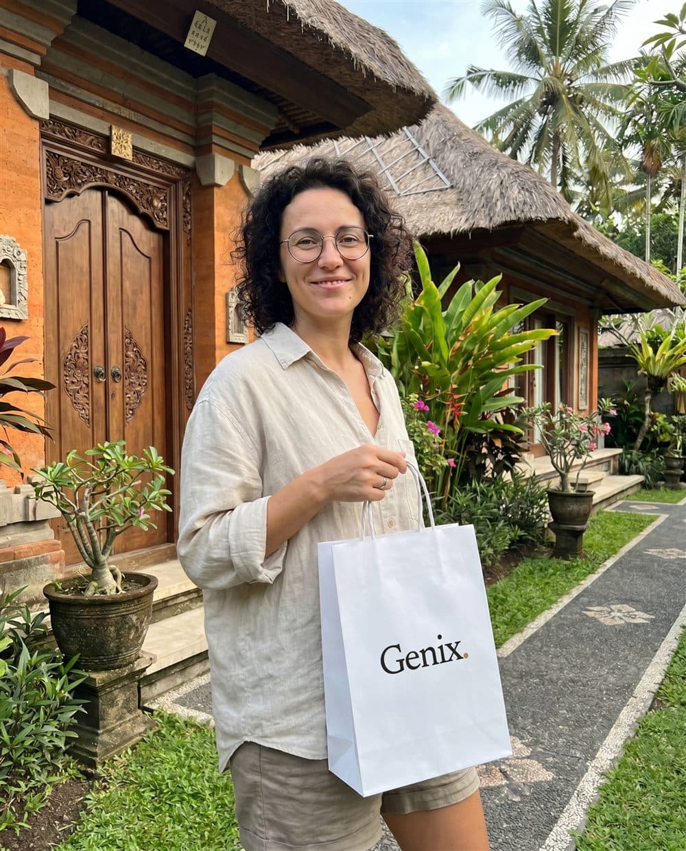 A Genix customer in Bali receiving their sealed delivery parcel