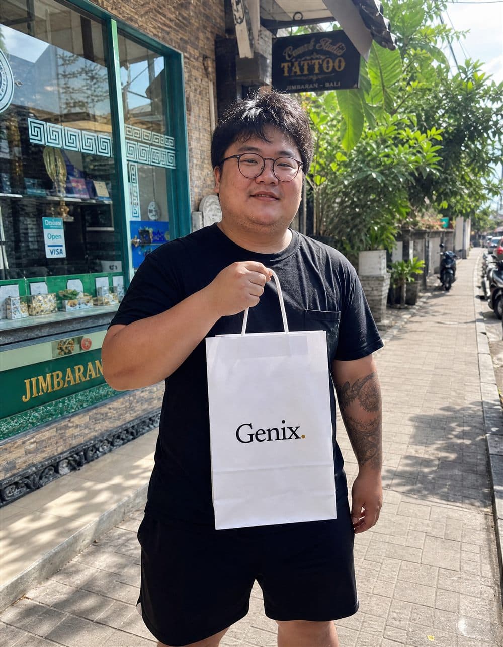 A Genix customer in Bali receiving their sealed delivery parcel